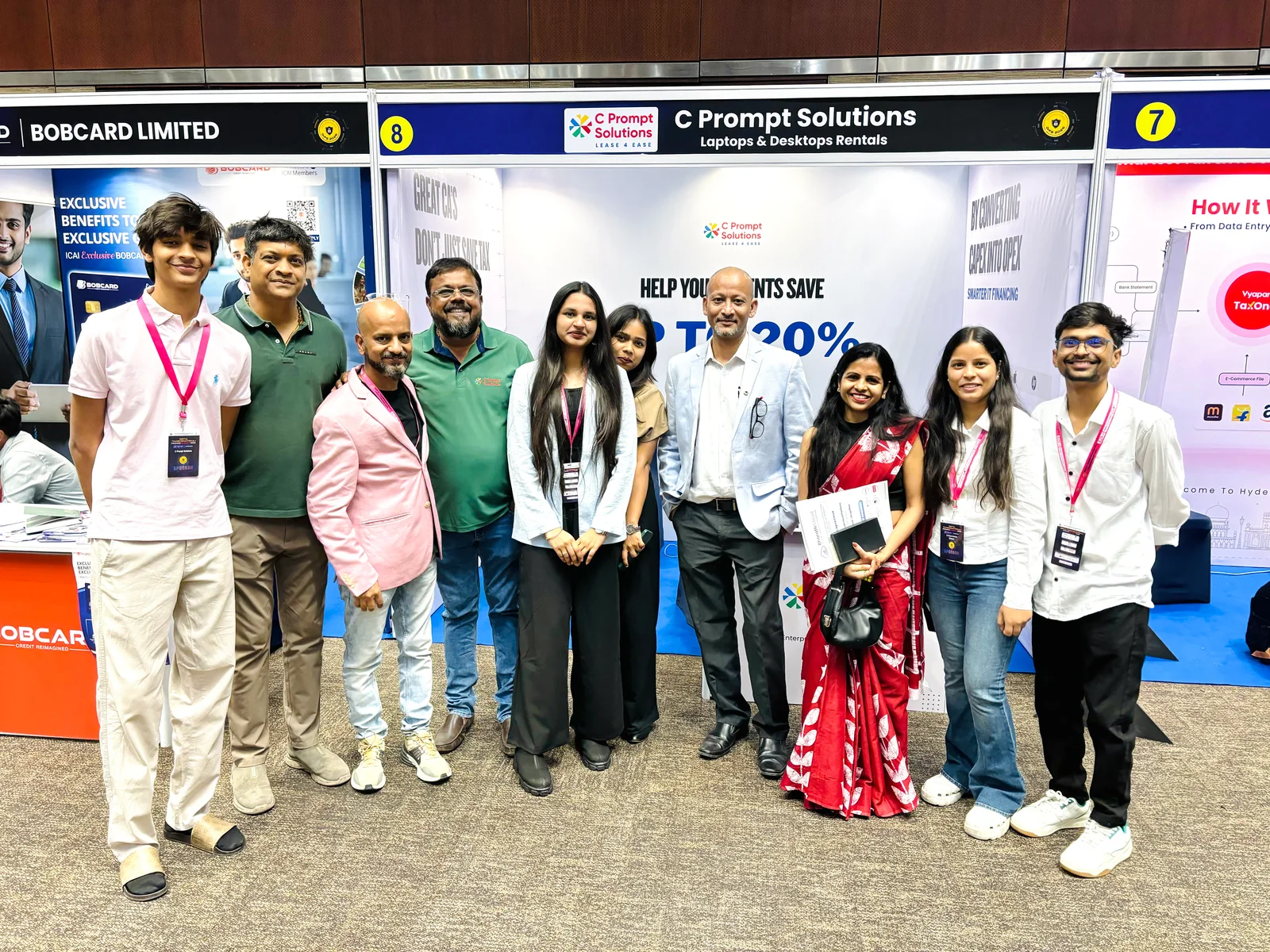 Attendees gathered at the C Prompt Solutions exhibition booth.